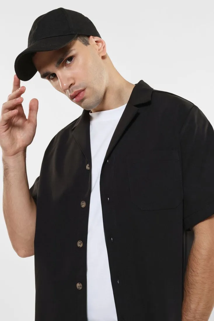 Camicia con bottoni a contrasto e tasca applicata
