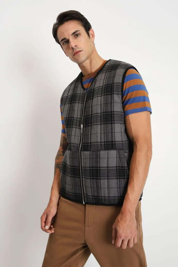 Gilet a quadri con zip e tasche oblique