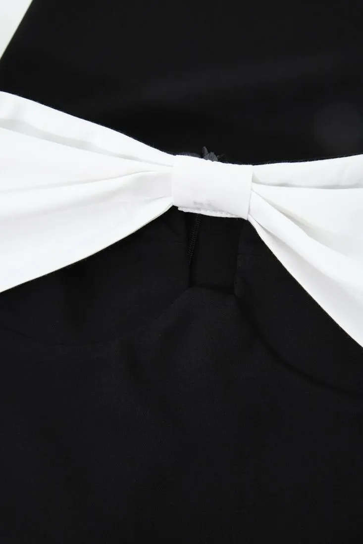 Mini abito con scollo alla Bardot, fiocco e cut-out
