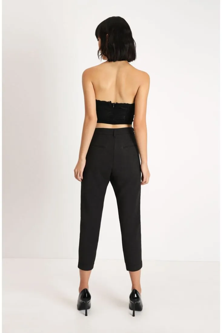 Pantaloni a sigaretta con risvolti