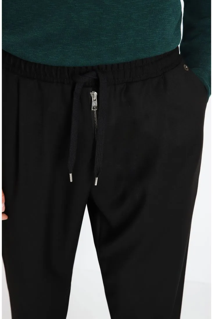 Pantaloni baggy con zip e coulisse