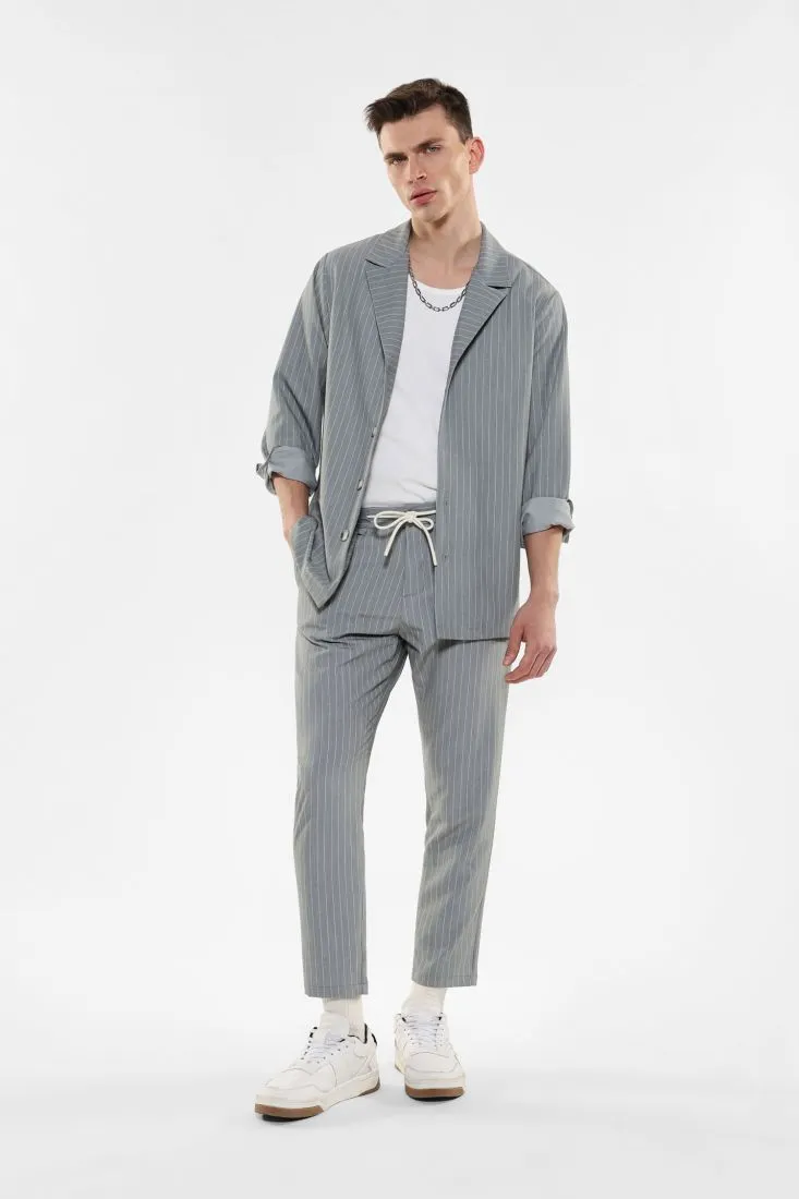 Pantaloni slim-fit fantasia gessata con coulisse