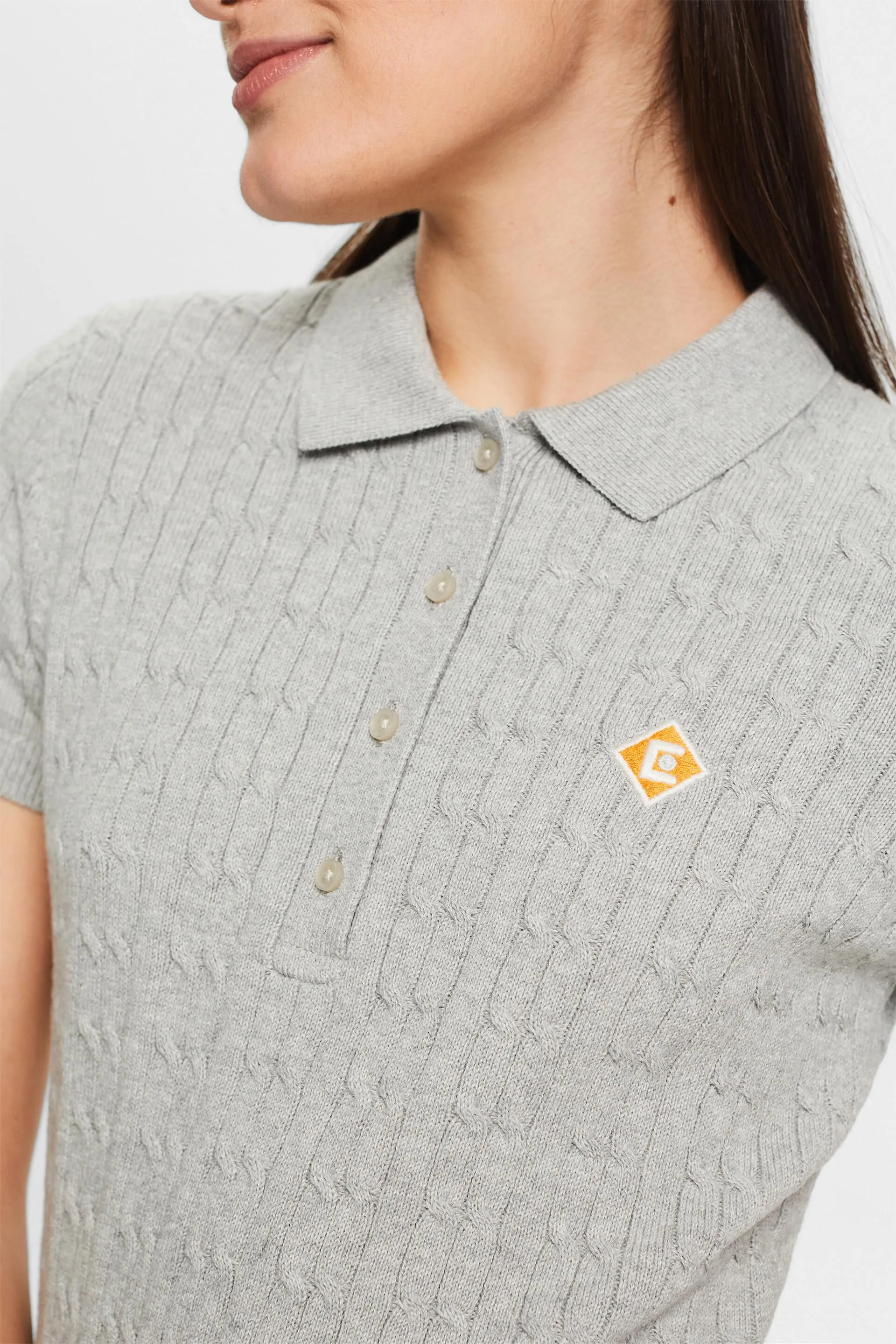 Polo a maglia a treccia